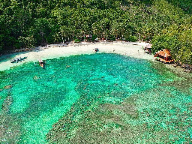 Bahia Tomini – aerial view of the secluded private bay on Malenge