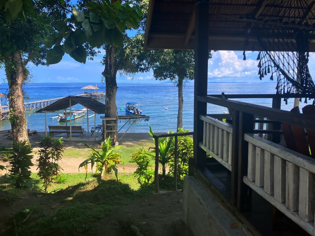 Pristine Paradise Una Una – Deluxe Seaview interior with king bed