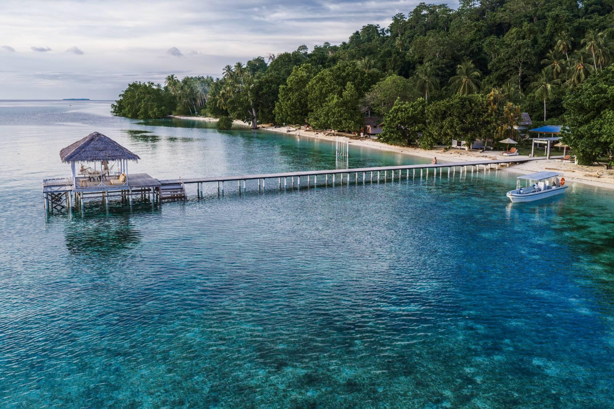 Reconnect – aerial view of the resort jetty over clear water