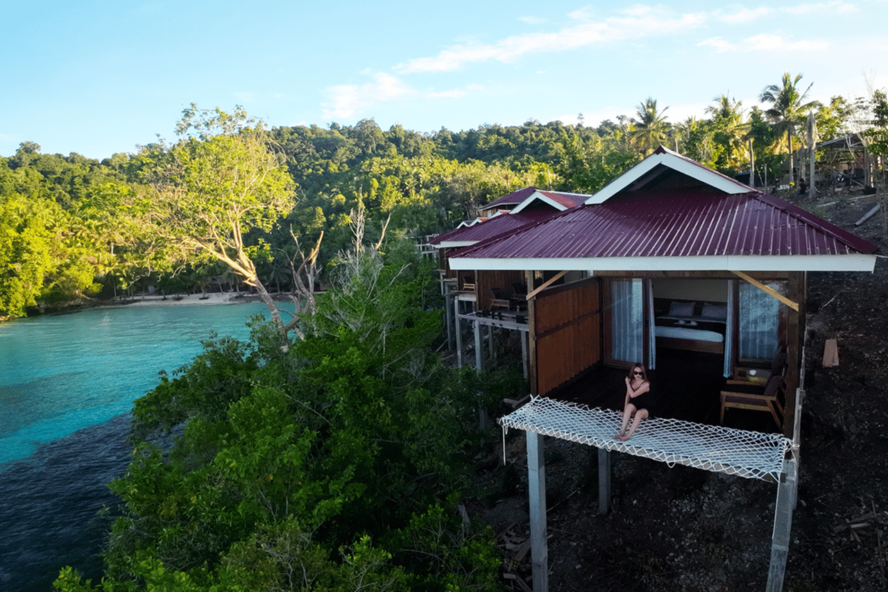 The Cliff Togean – modern bungalow interior with king bed