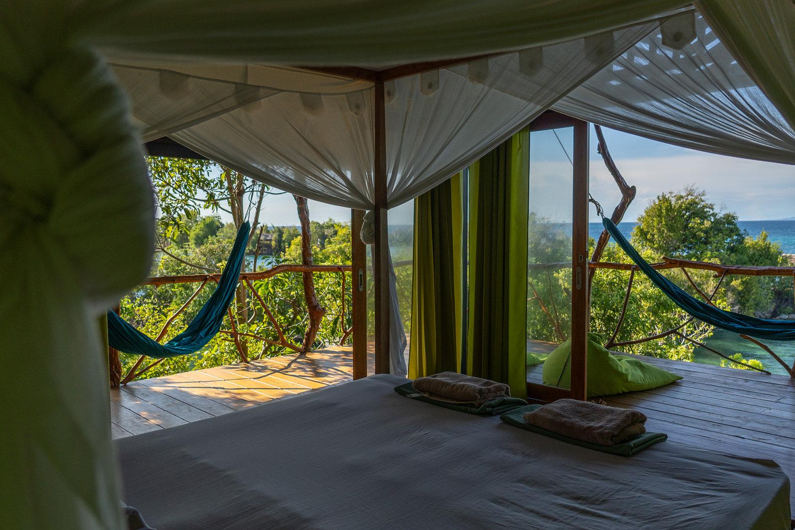 Araya Dive Resort – treehouse interior with bay view