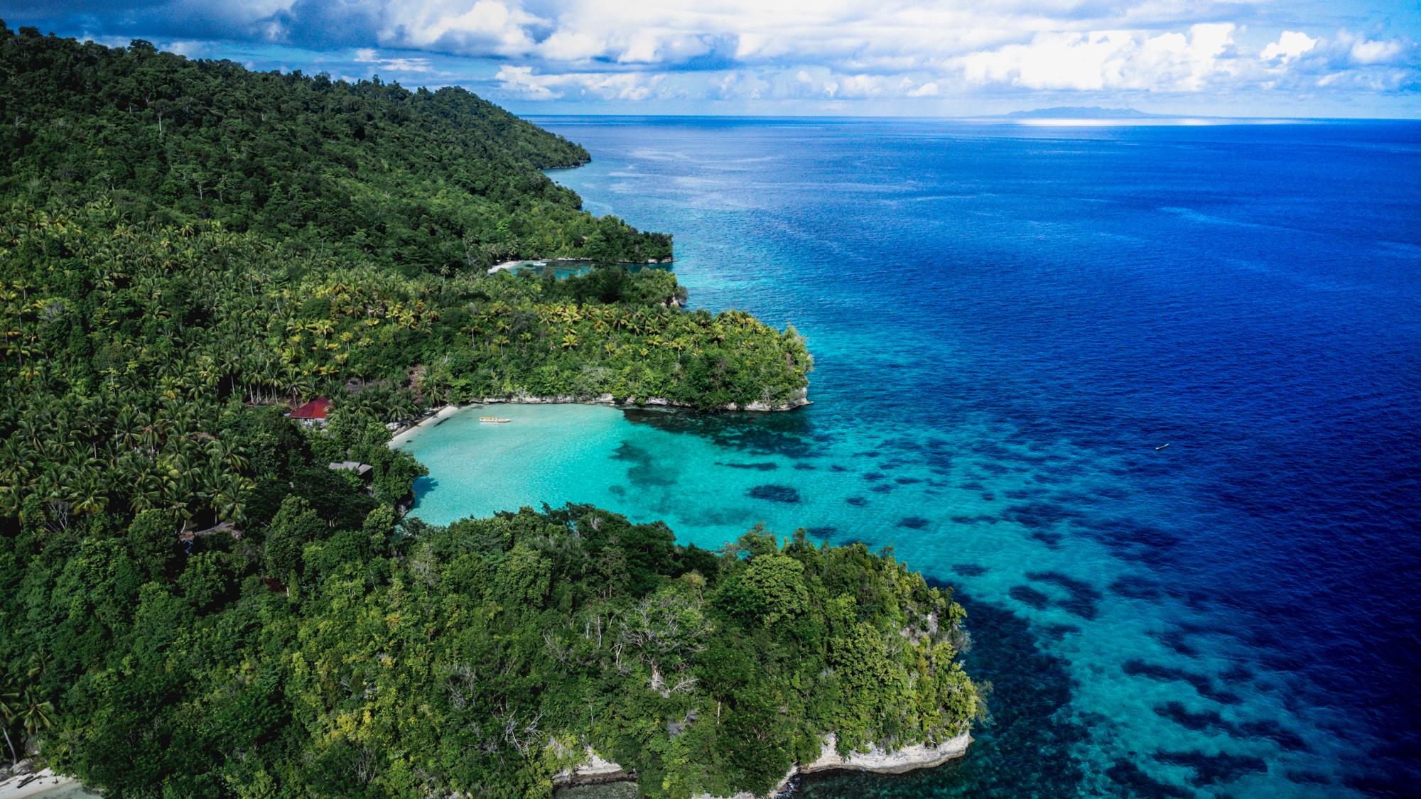 Sera Beach Dive Resort – aerial view of the resort cove